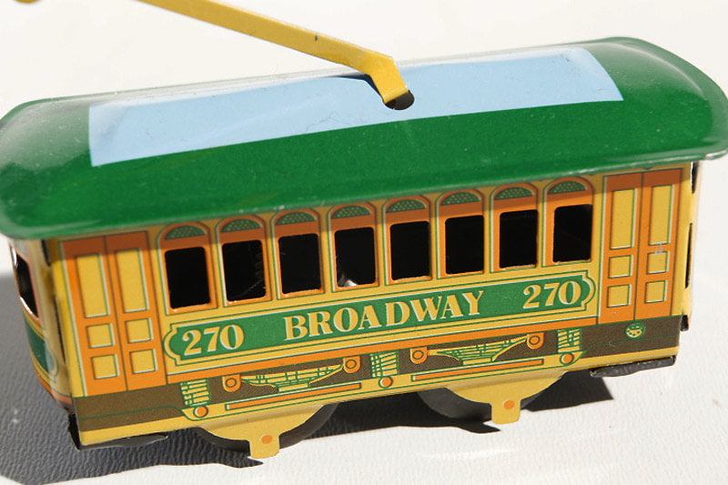 Small tram tin toy - yellow and green