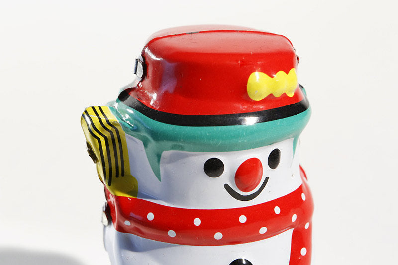Colourful snowman Tin toy with a red hat and white polka dot scarf 