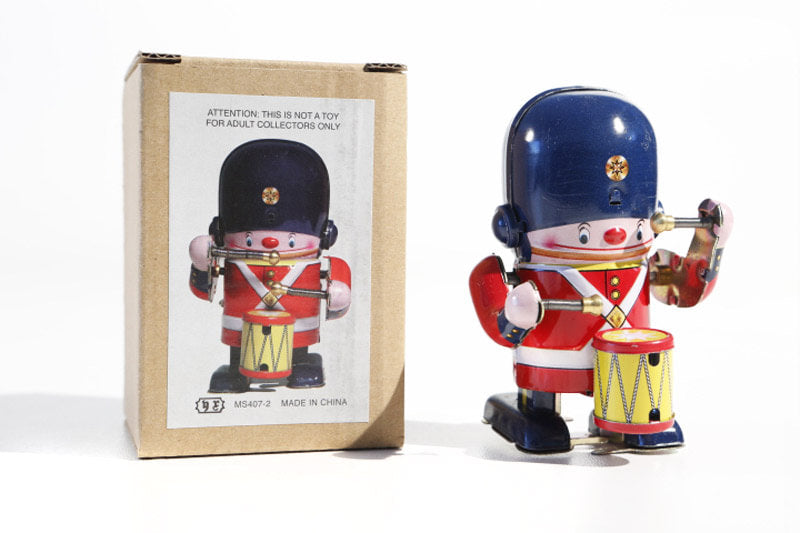 Small drumming soldier boy tin toy with packaging