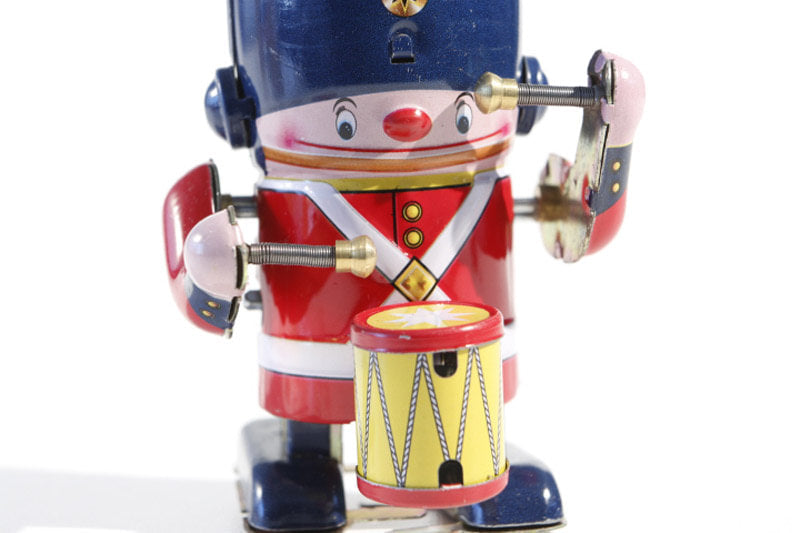 Close up of Small drumming soldier boy tin toy
