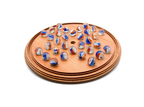 Wooden solitaire board game with colourful glass marbles 