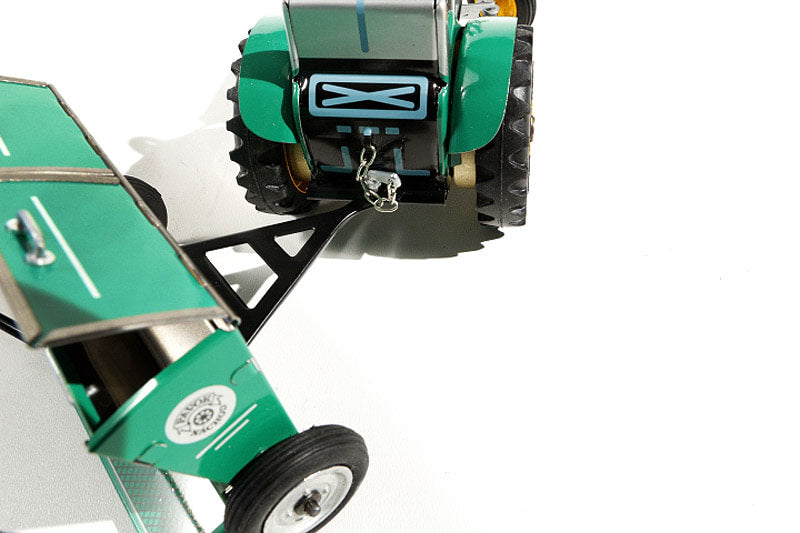Close up of Sowing Machine tin toy