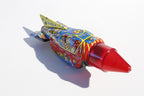 Colourful Space rocket tin toy  with space-themed graphics 