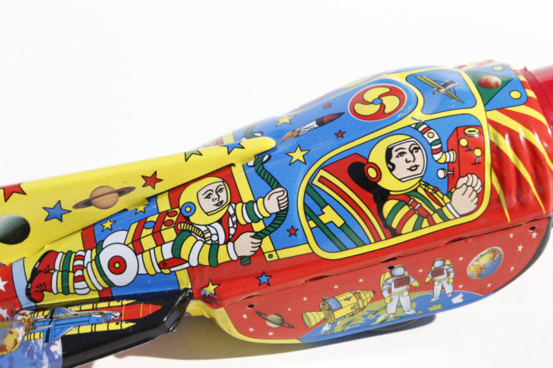 Colourful Space rocket tin toy  with space-themed graphics 