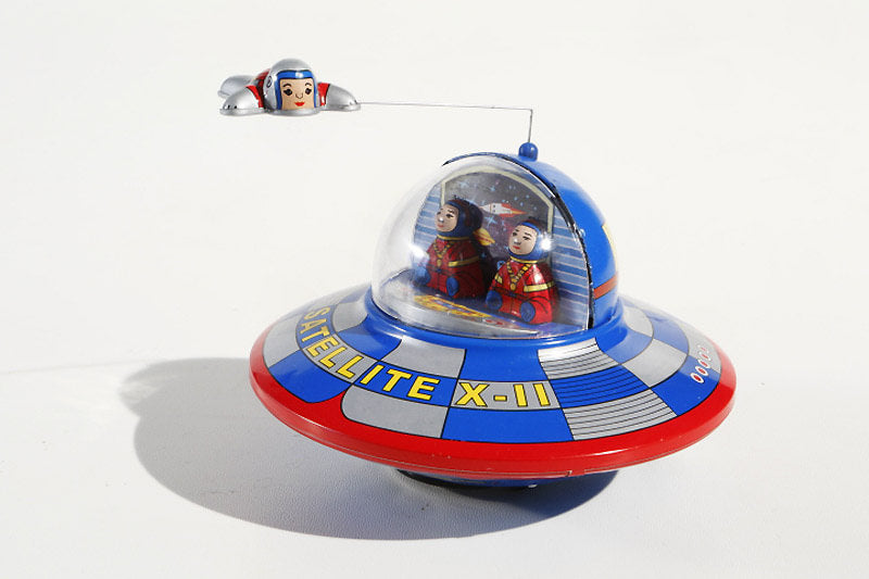 Spaceship Tin toy with flying astronaut 