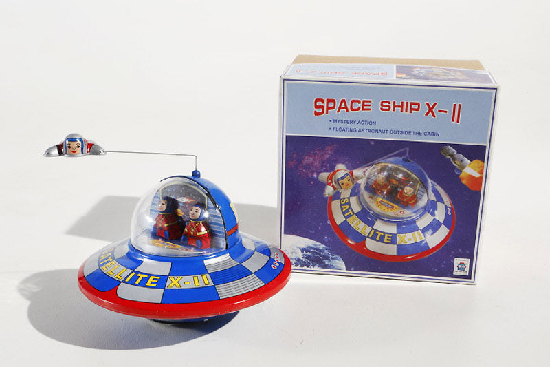 Spaceship Tin toy with flying astronaut and packaging