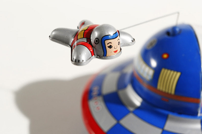Spaceship Tin toy with flying astronaut 
