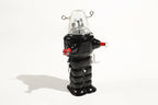 Black robot space trooper tin toy with clear dome and red accents