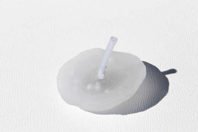 White candle with a wick 