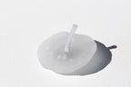 White candle with a wick 