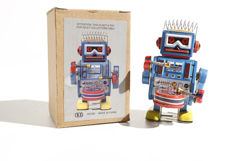 Spikey hair drumming Vintage-style robot tin toy with packaging