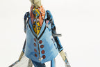 Close up of Paya imitation Student with suitcase tin toy