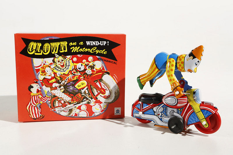 Stunt Clown on motorcycle tin toy with colourful packaging
