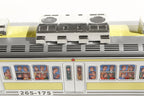 Close up of subway train tin toy with passengers 