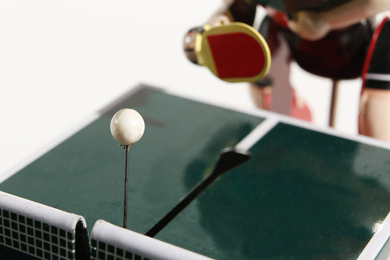 Close up of Table tennis players tin toy