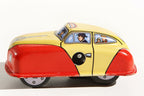 Taxi tin toy car with a yellow and red body