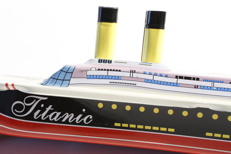 Close up of Titanic Pop Pop candle Boat tin toy