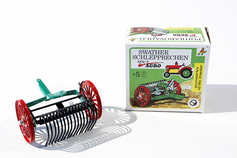 Towed Rake tin toy with packaging