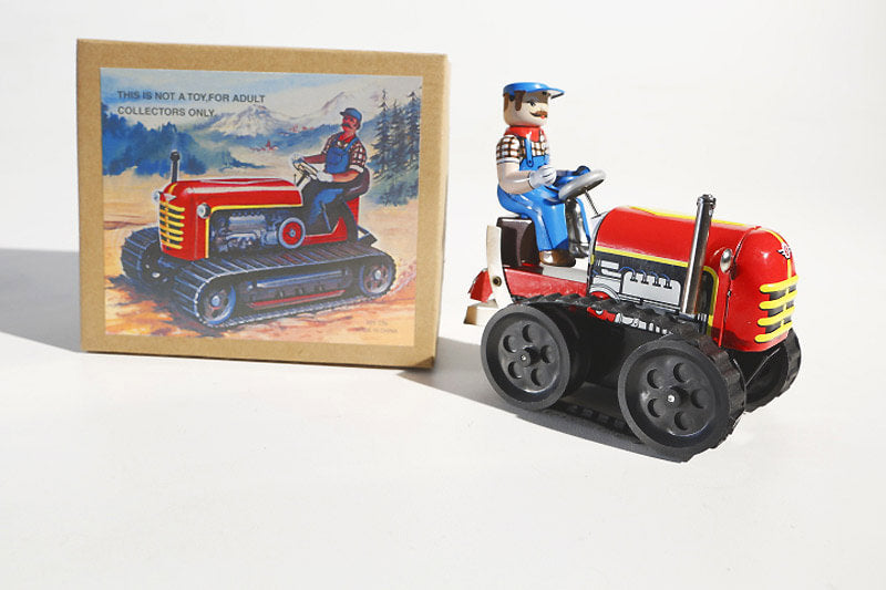 Caterpillar tractor tin toy with colourful packaging
