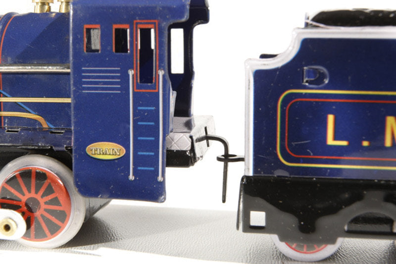 Close up of Train & Carriages tin toy