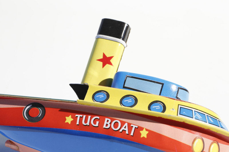 Close up of Tin Treasure's Pop Pop Tug Boat tin toy