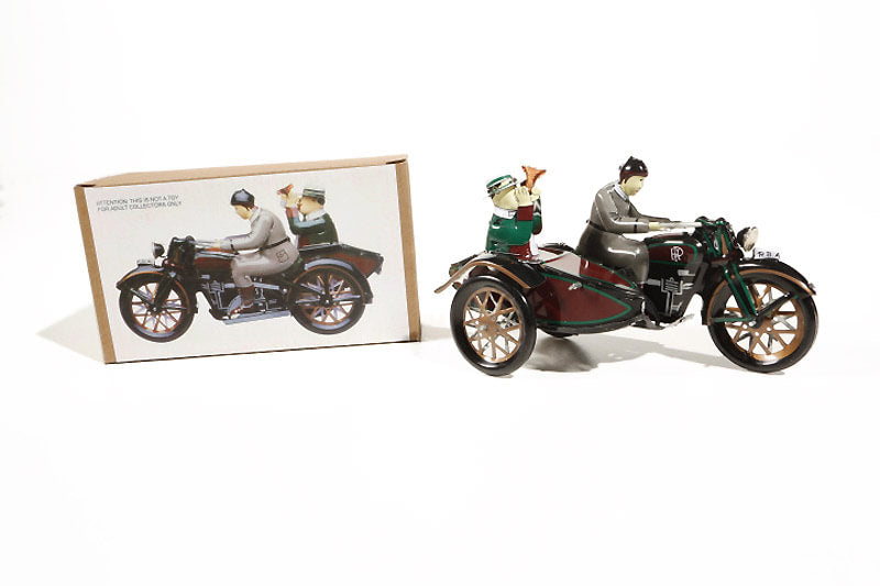 Motorcycle and sidecar "tuttut" tin toy with packaging