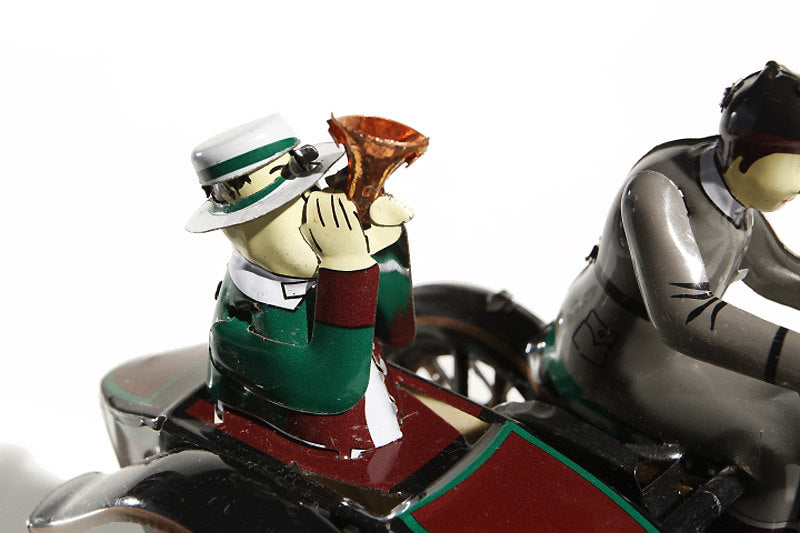 Cloe up of Motorcycle and sidecar "tuttut" tin toy