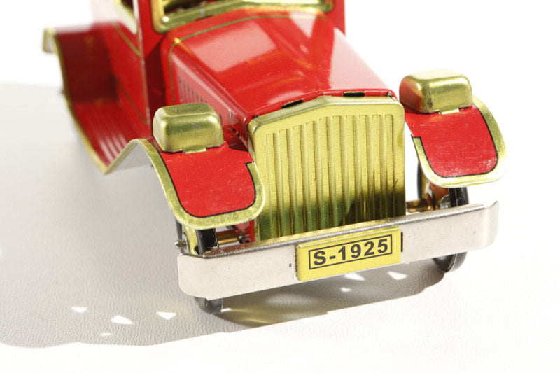 Vintage rolls Royce tin toy car with red body and gold accents, featuring a 'S-1925' license plate.