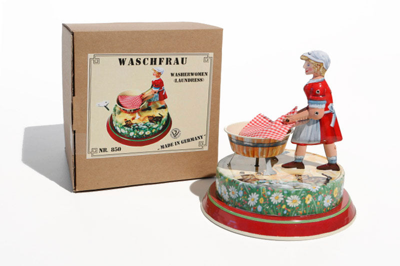 Washer Woman tin toy with packaging