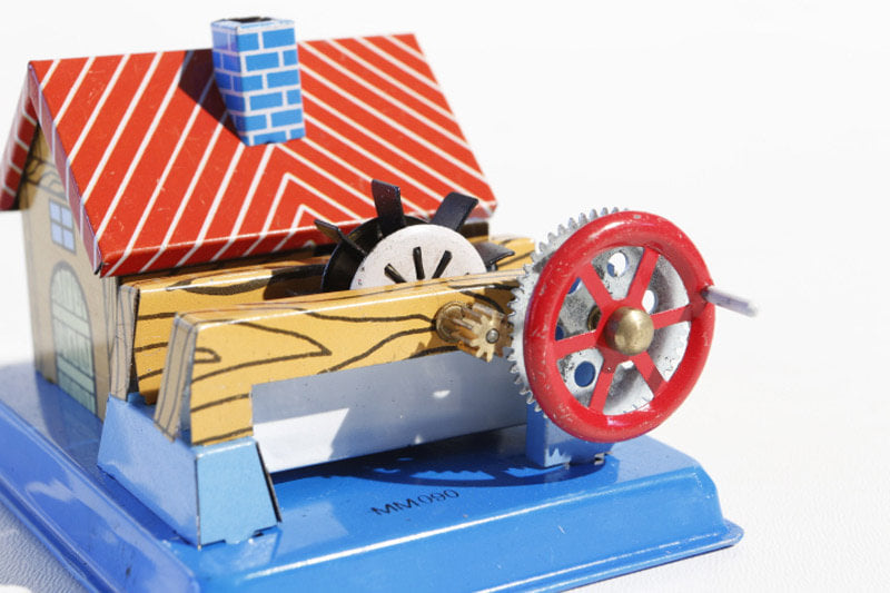 Close up of Water mill tin toy