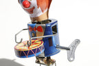 Close up of Welby Drumming Clown tin toy wind up key