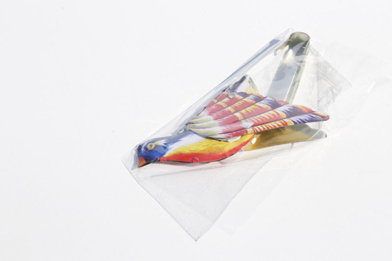 Colourful whistling bird tin toy