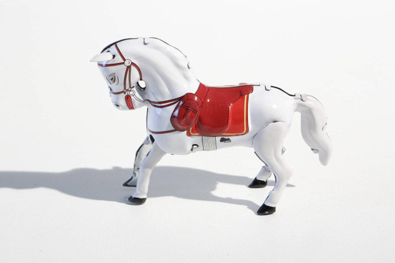 White Jumping horse tin toy 