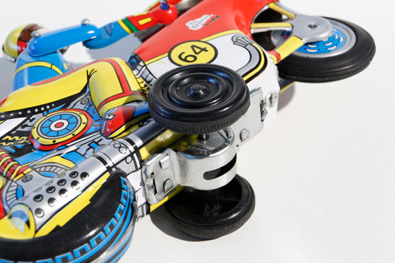 Close up of Winner Motorcycle Friction powered tin toy